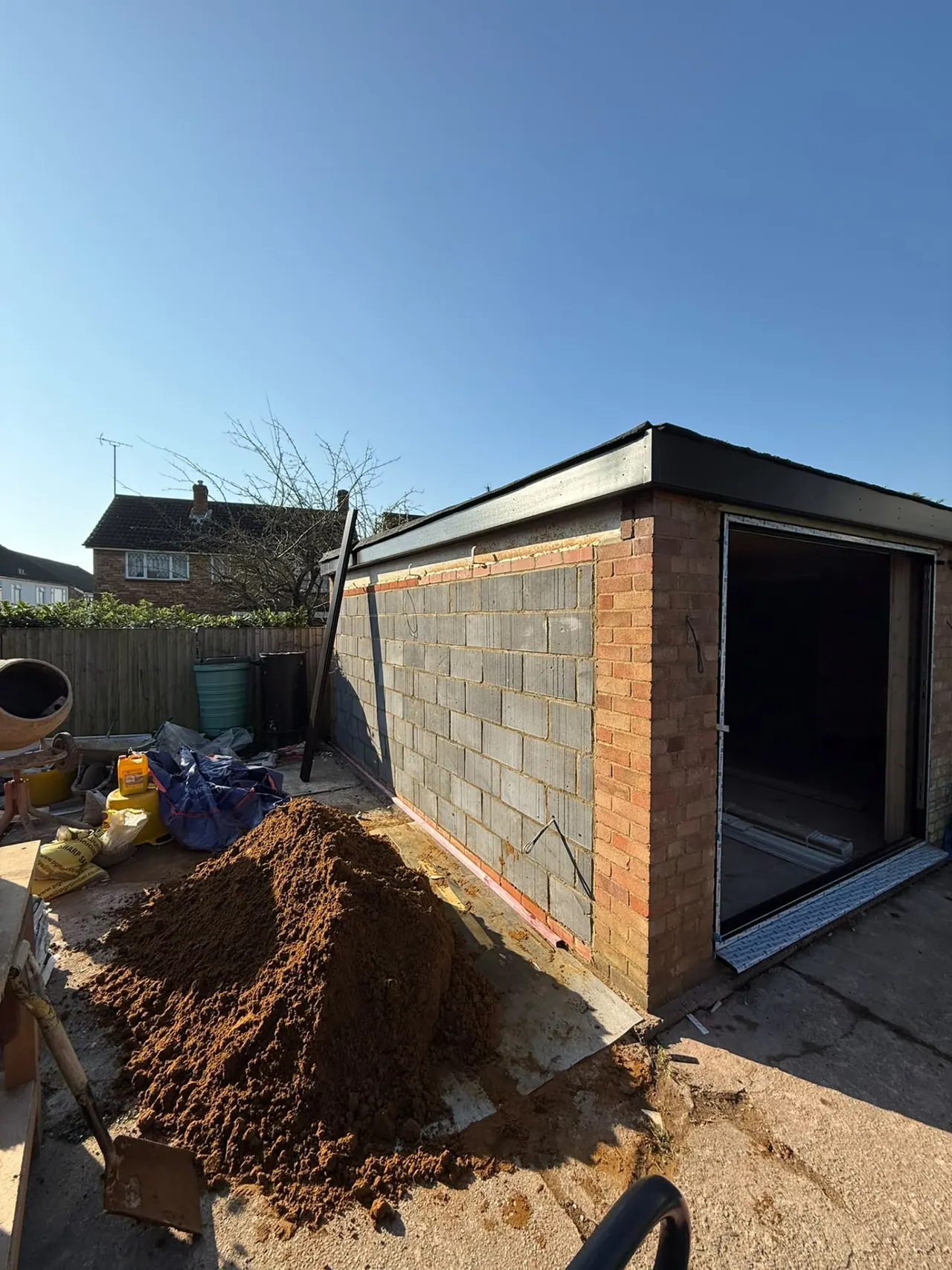 Garden room under construction with block walls and timber roof in Essex