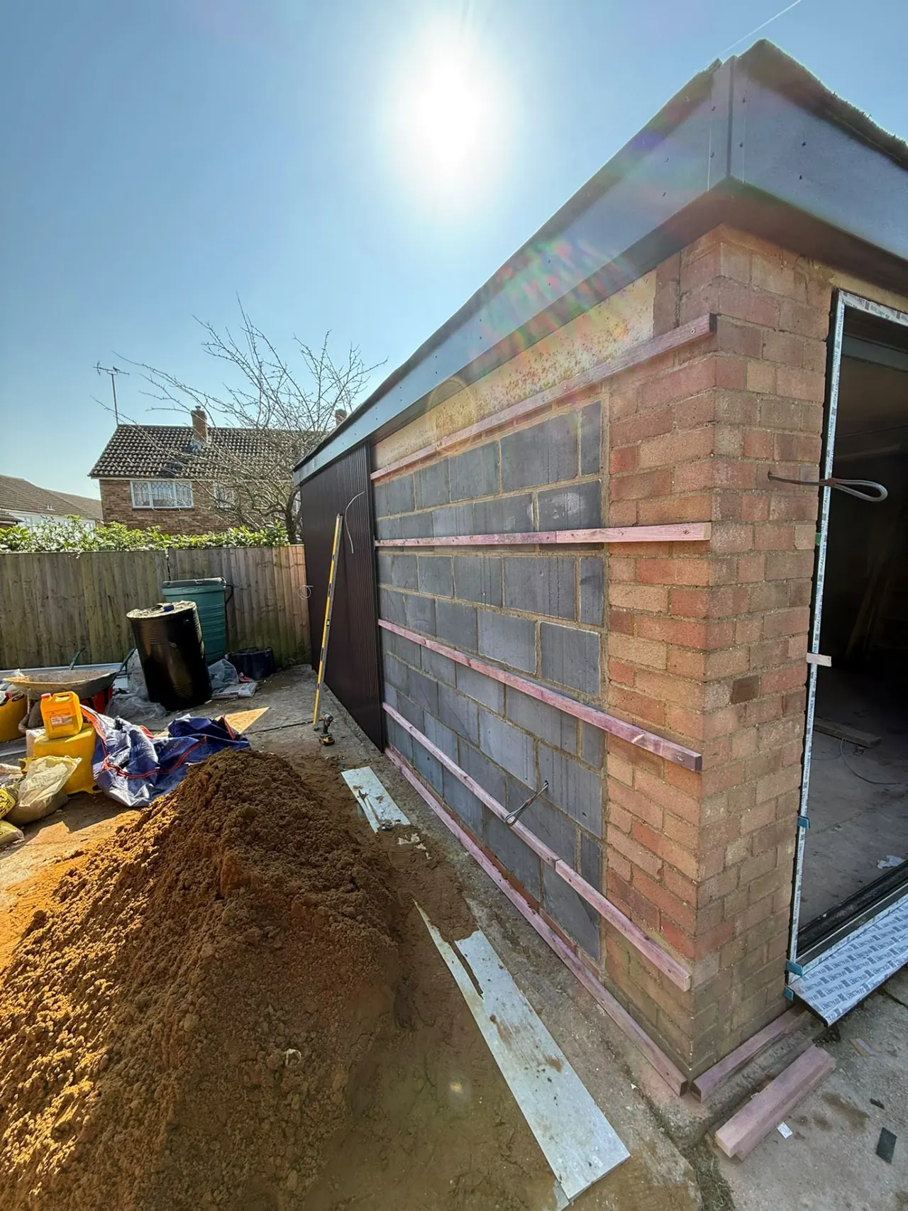 Garden room under construction with block walls and timber roof in Essex