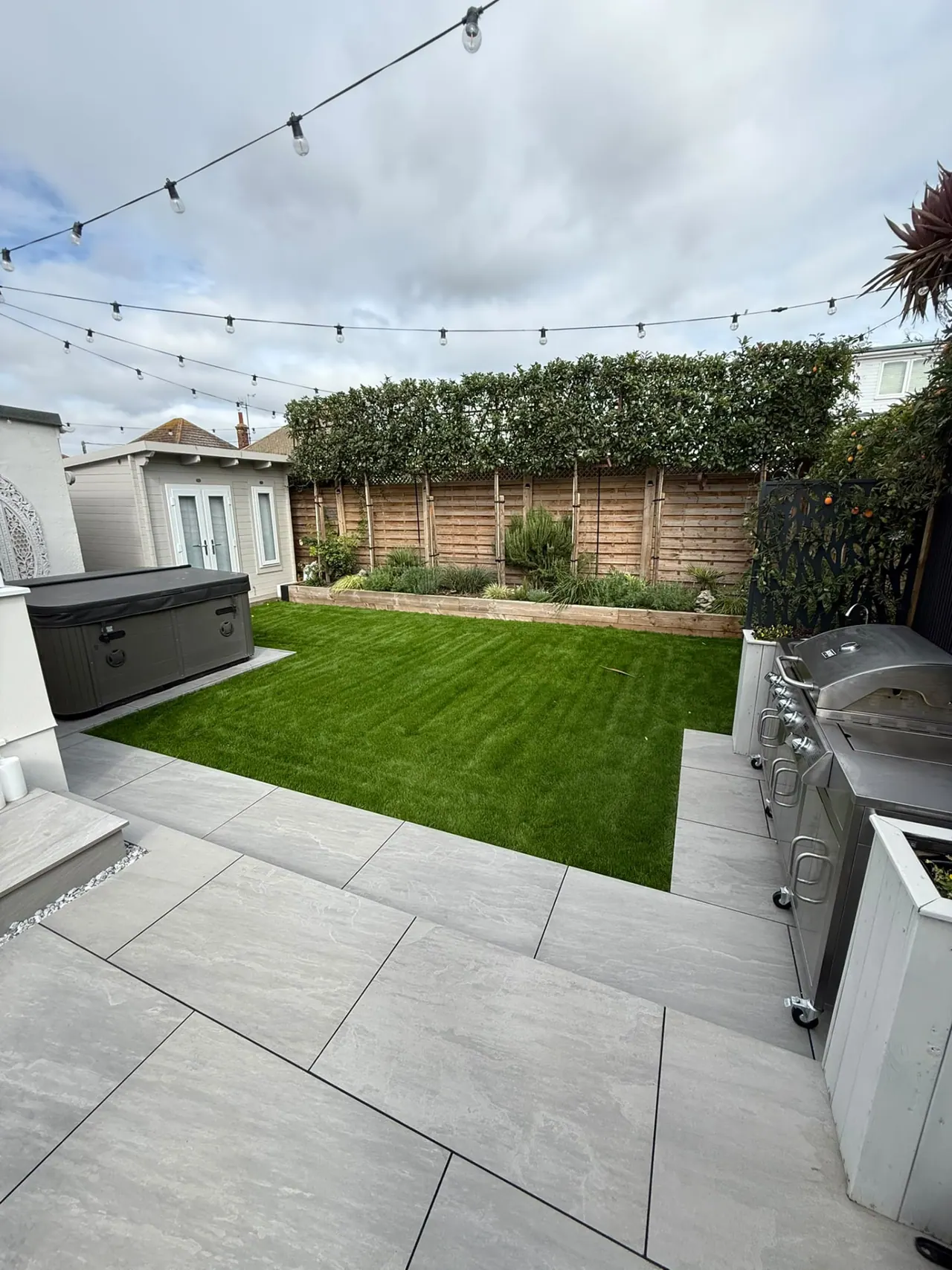 Completed porcelain patio, new fencing and lawn in a Southend-on-Sea garden