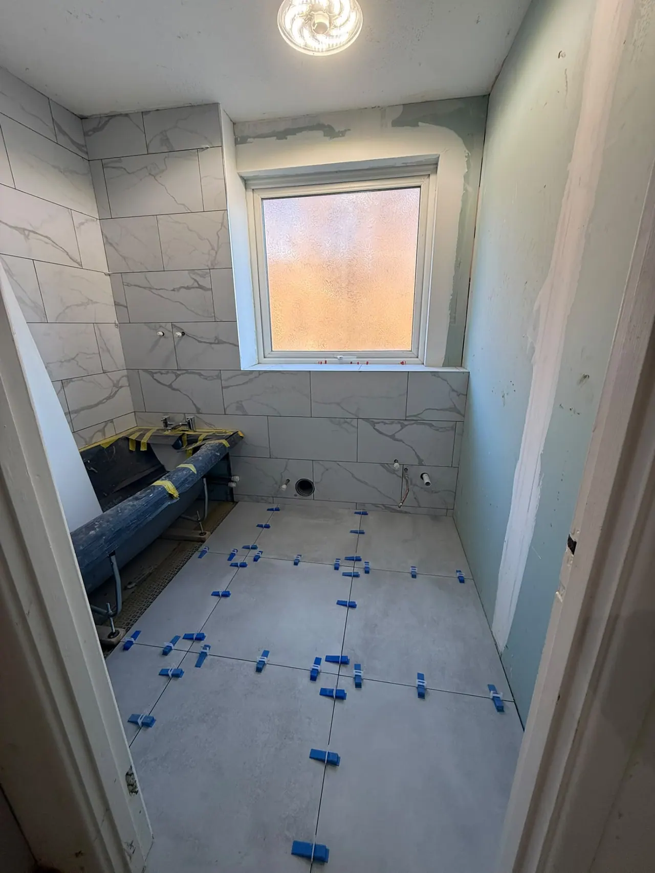 Bathroom before renovation in Southend-on-Sea, showing the original fittings and strip-out
