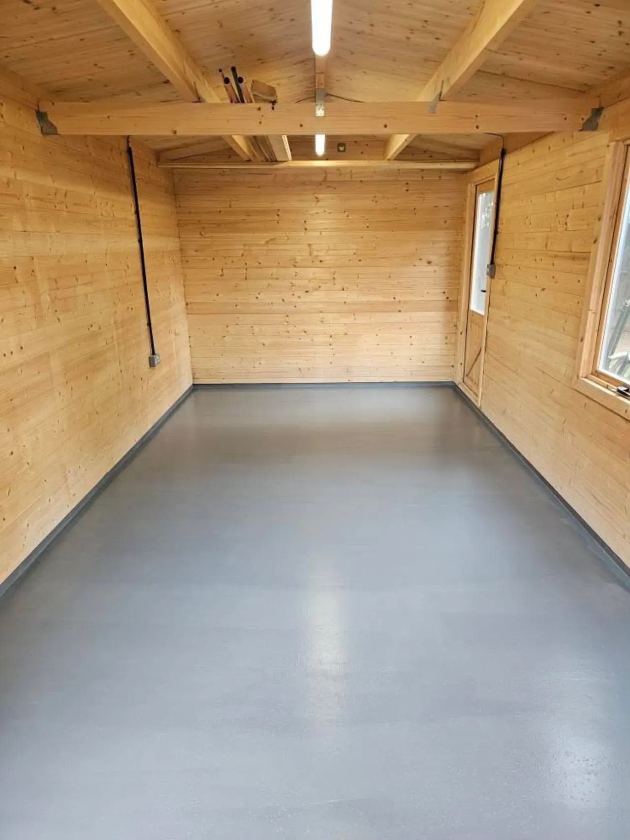 Flooring Installation in Southend-on-Sea – New floor installed inside a timber garden building in Essex