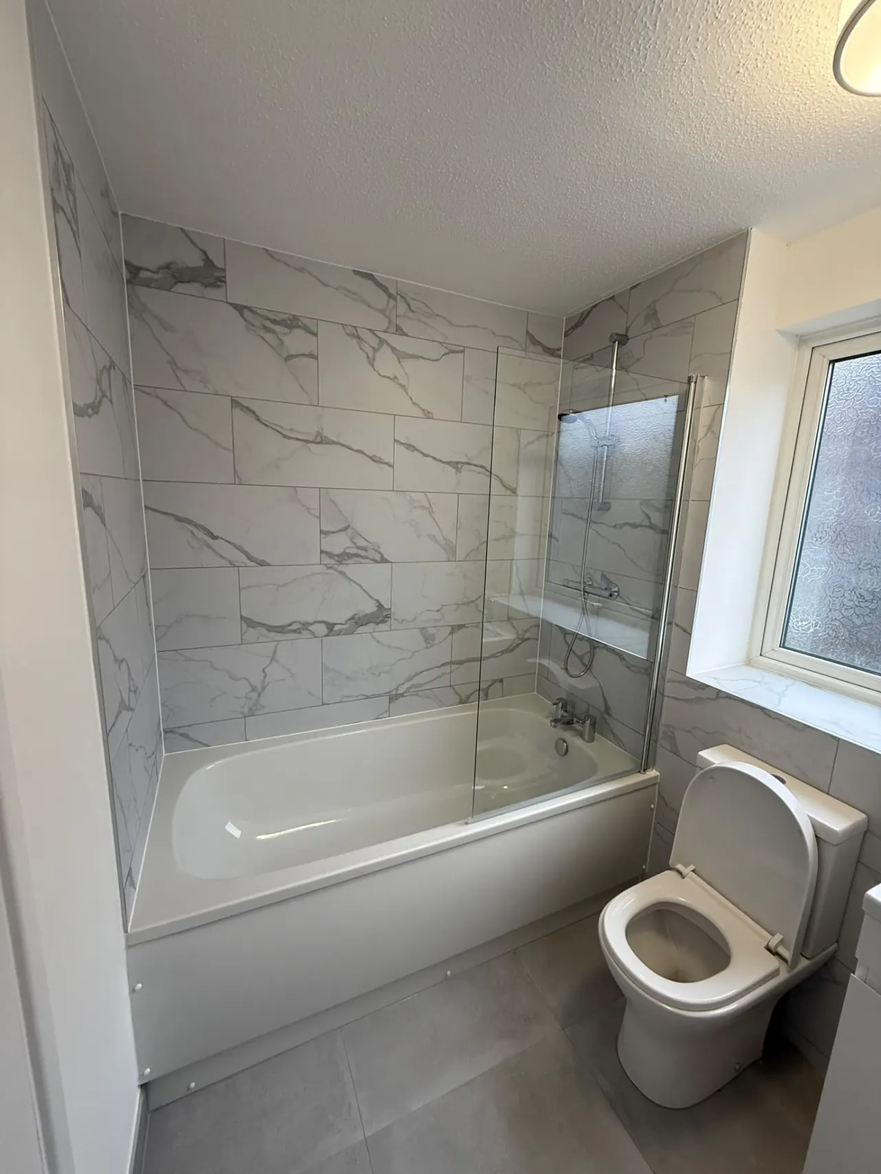 Completed bathroom renovation in Southend-on-Sea with new tiling, sanitaryware and shower