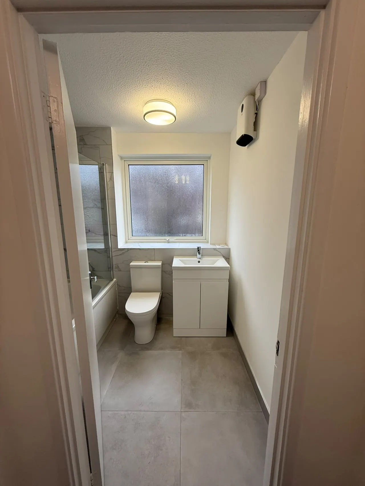 Completed bathroom renovation in Southend-on-Sea with new tiling, sanitaryware and shower