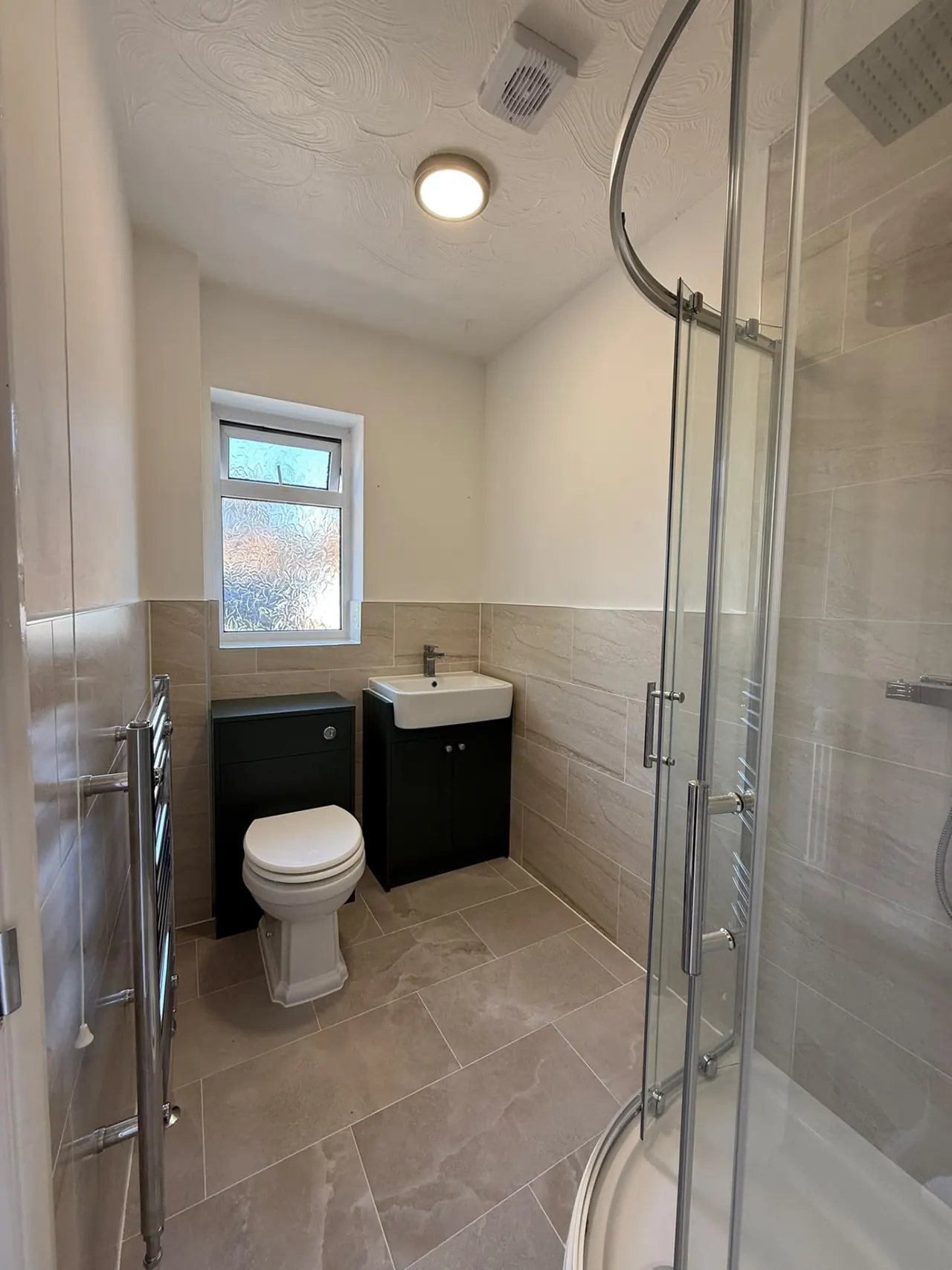 Completed bathroom renovation in Southend-on-Sea with new tiling, sanitaryware and shower