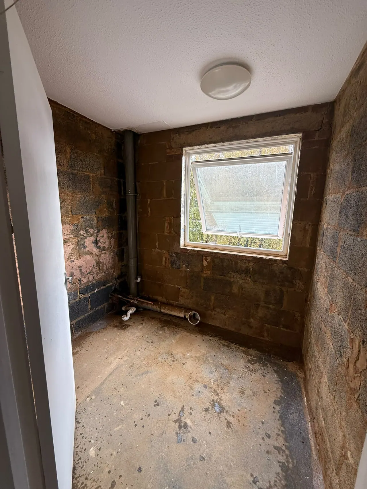 Bathroom before renovation in Southend-on-Sea, showing the original fittings and strip-out